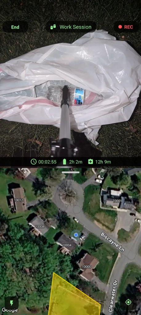 The recording screen during a work session: the camera looks down a grabber into an open trash bag, with the session timer and a zone map below.